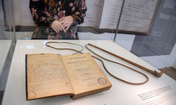 10 December 2018, Baden-Wuerttemberg, Stuttgart: A New Testament and a whip from the estate of Hendrik Witbooi are in a display case in the Linden Museum of Ethnology. The state of Baden-W?rttemberg wants to return the exhibits as stolen cultural assets to Namibia in February. Both objects will be exhibited again in the Lindenmuseum until they are returned. Photo: Marijan Murat/dpa (Photo by Marijan Murat/picture alliance via Getty Images)
